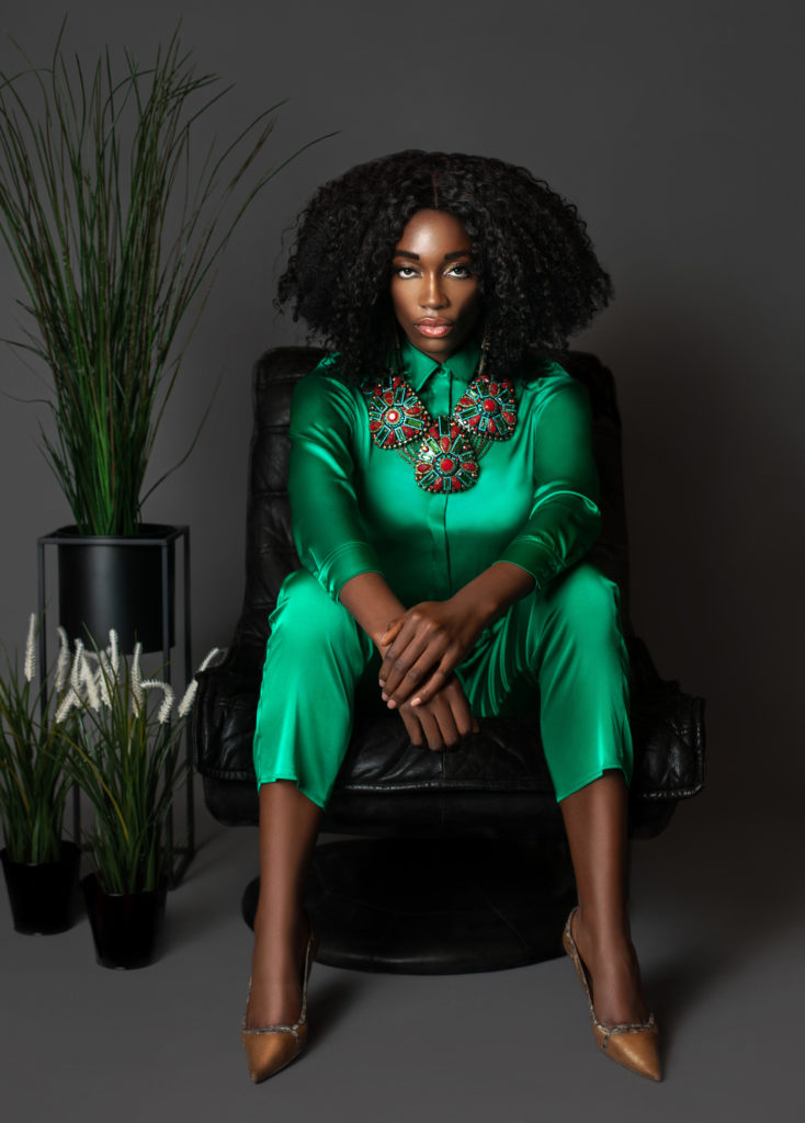 Black girl wearing a green Silk Dress by MADS NORGAARD for Spring 2021 Fashion Trends 