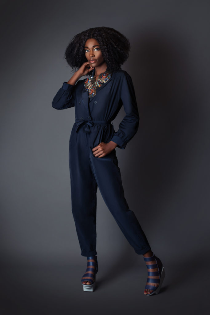 Black girl wearing a blue romper for Spring 2021 Fashion Trends 